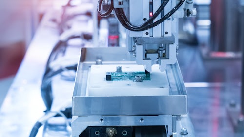 SMT machine being used in electronics manufacturing